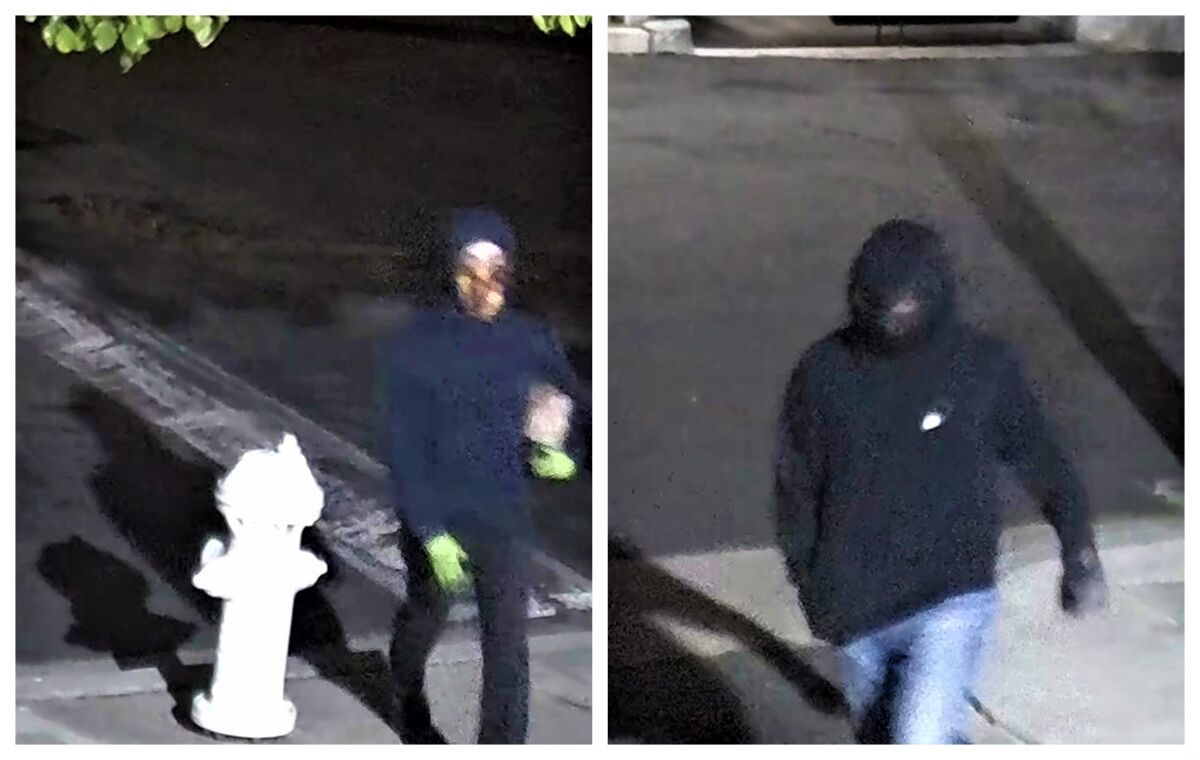 Two suspects seen on video March 13, 2022, are wanted by FBI for allegedly tossing a Molotov cocktail at a health center.