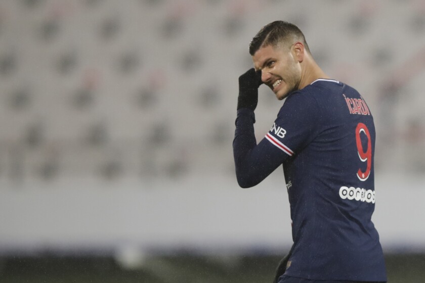PSG's Mauro Icardi reacts after missing a chance to score during the Champions Trophy soccer match between Paris Saint-Germain and Olympique Marseille at the Bollaert stadium in Lens, northern France, Wednesday, Jan.13, 2021. (AP Photo/Christophe Ena)