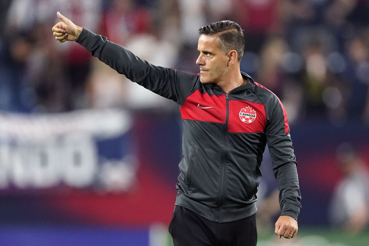 Canada coach John Herdman salutes the crowd after a 1-1 draw against the U.S. on Sept. 5 