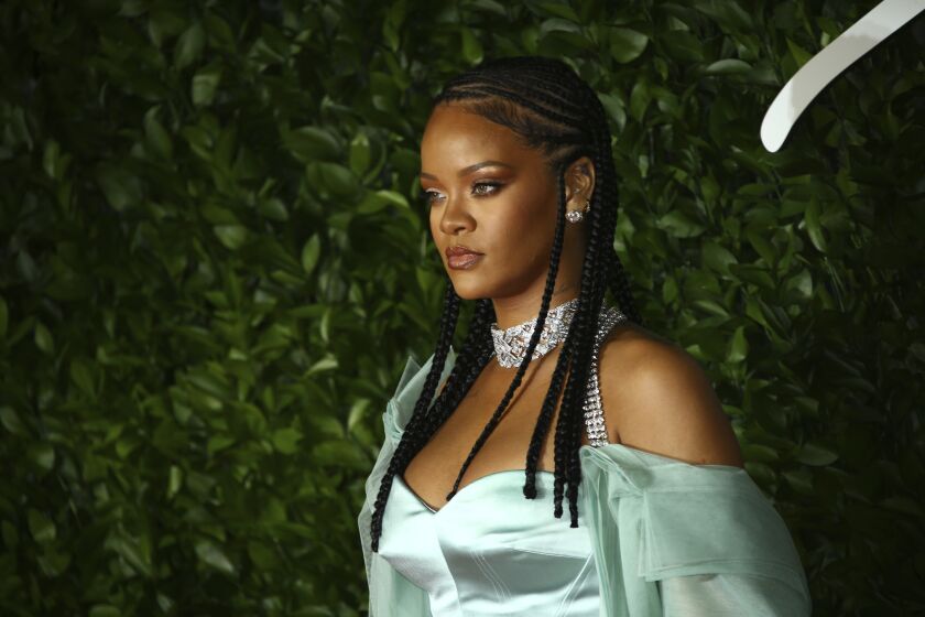 Singer Rihanna poses for photographers upon arrival at the British Fashion Awards in 2019. 