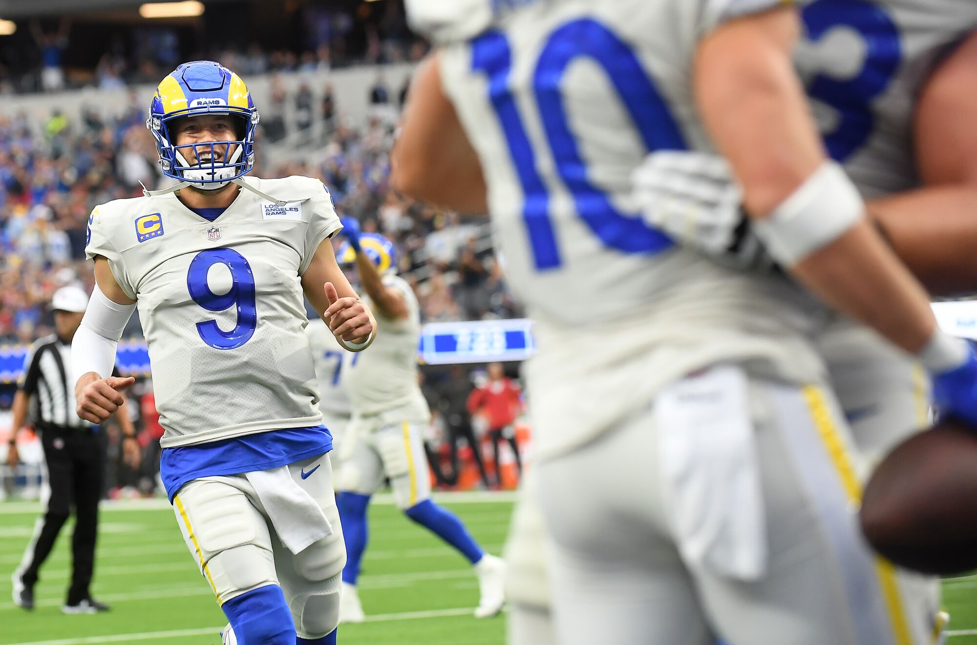 Rams quarterback Matthew Stafford celebrates his touchdown pass to Cooper Kupp.