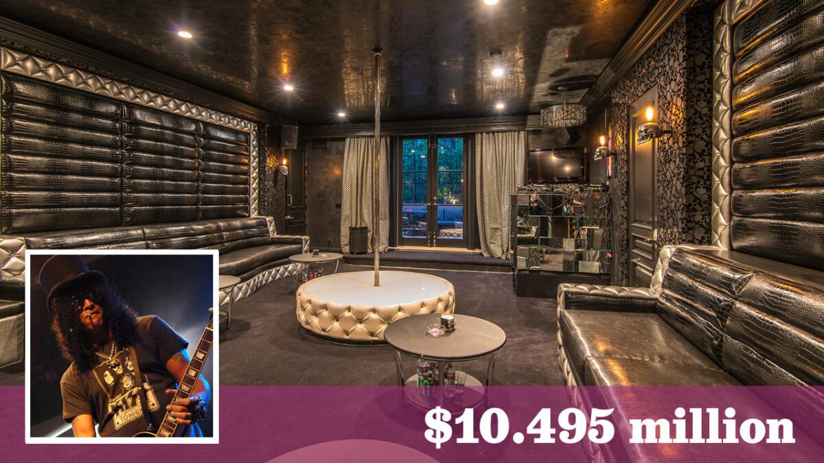 Guns N' Roses guitarist Slash has lowered the asking price on his over-the-top villa in the Mulholland Estates.