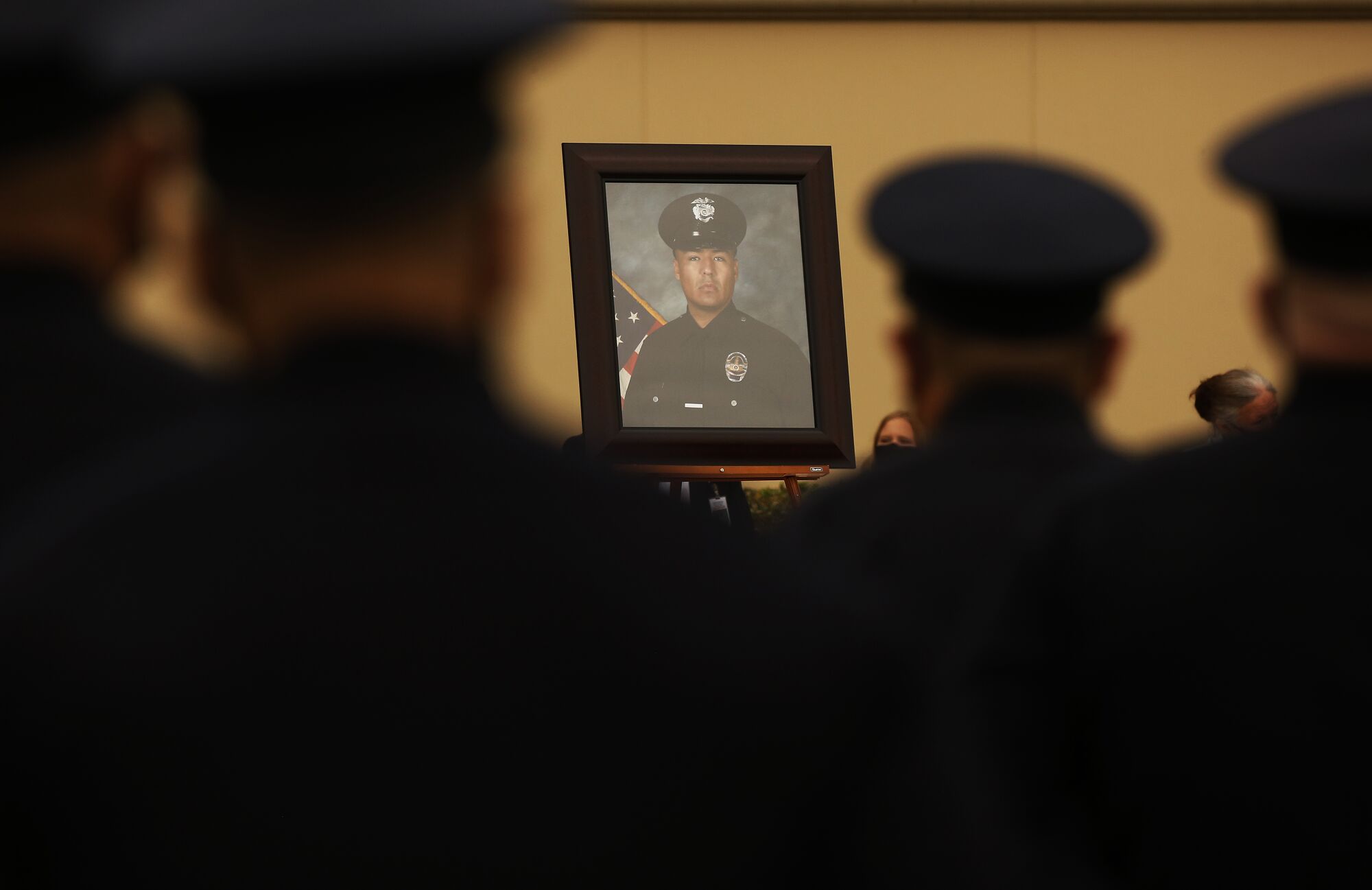 A photo of Officer Valentin Martinez at the memorial service.