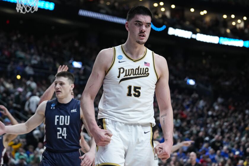 FILE - Purdue center Zach Edey (15) reacts after being fouled by Fairleigh Dickinson in the second half of a first-round college basketball game in the men's NCAA Tournament in Columbus, Ohio, Friday, March 17, 2023. Edey was honored Friday, March 31, 2023, as The Associated Press men's college basketball Player of the Year. (AP Photo/Michael Conroy, File)