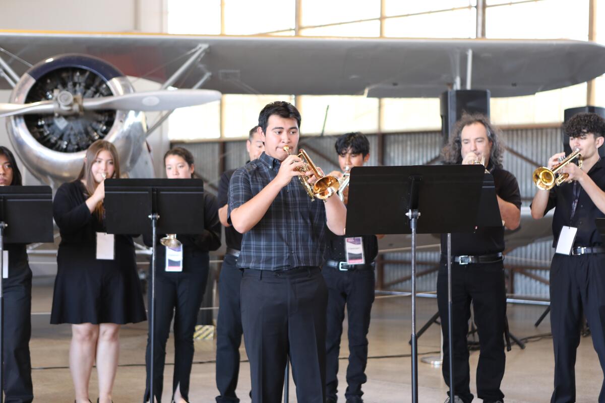 Rudy Xool plays the trumpet at the groundbreaking of the Orange County Music & Dance campus.