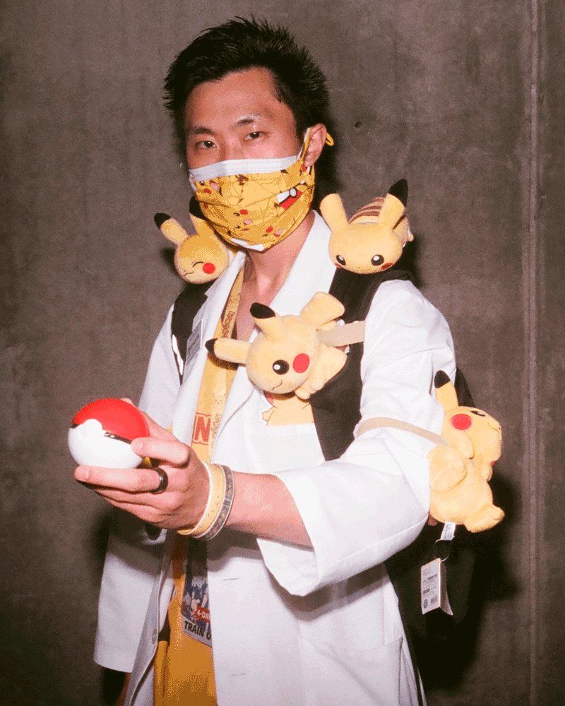 A gif of a man in a Pikachu face mask with small stuffed Pikachus all over his body.