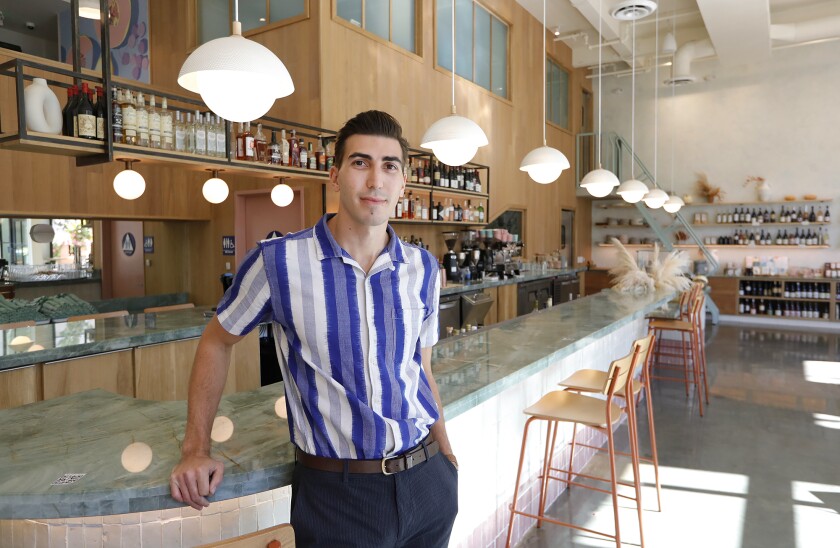 Owner George Barker stands at the bar of the new Mayfield restaurant in San Juan Capistrano.