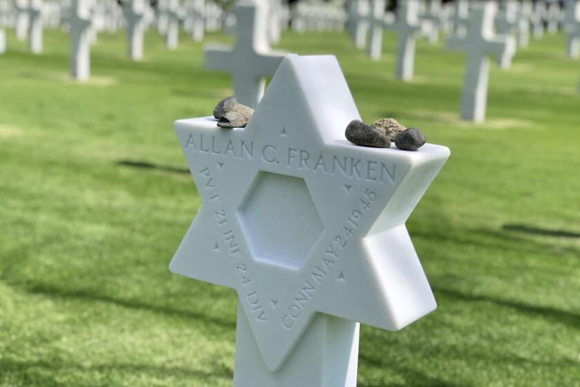 The gravestone of Pvt. Allan C. Franken, a Jewish soldier killed in the Philippines in the final months of World War II, was changed to a Star of David in a ceremony at the Manila American Cemetery, Feb. 12, 2020.