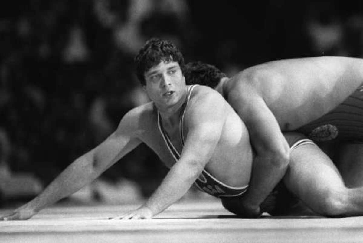 Jeff Blatnick, left, wrestles with Thomas Johansson of Sweden in the gold-medal match at the 1984 Olympics.
