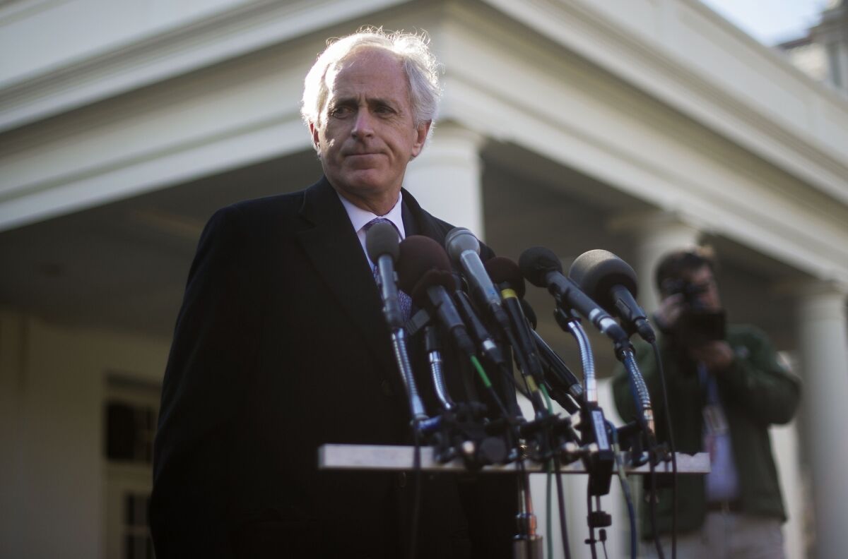 Sen. Bob Corker (R-Tenn.) talks with reporters Tuesday at the White House after a meeting with President Obama about Iran.