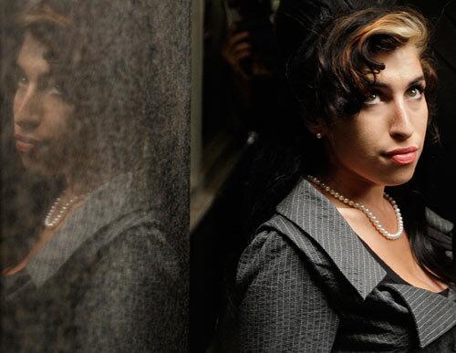 Singer Amy Winehouse was banned from the United States over drug and assault arrests in her native England.