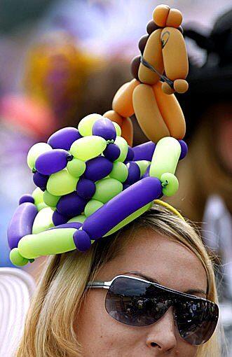 This spectator dons an unusual Kentucky Derby balloon hat on Saturday at Churchill Downs in Louisville, Ky.
