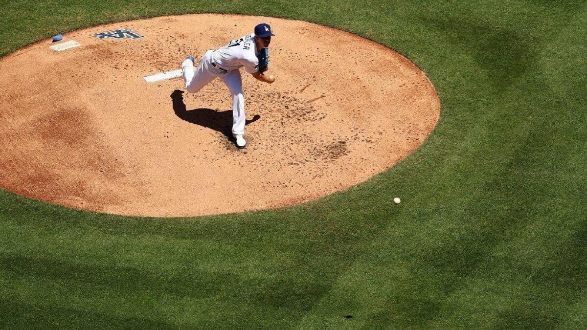 The Dodgers' Walker Buehler delivers a pitch during a game against the Cincinnati Reds on April 17 at Dodger Stadium.