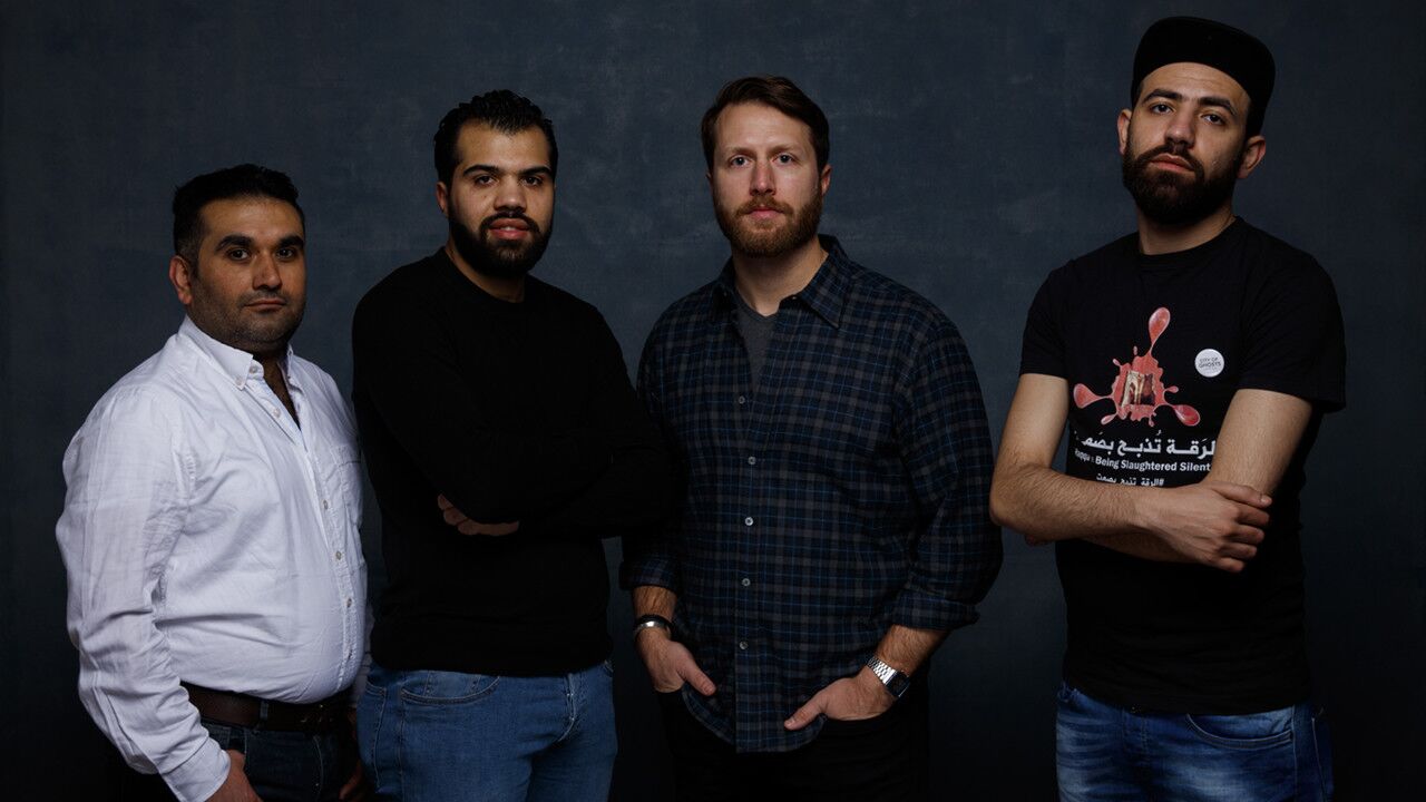 Director Matt Heineman, second from right, and citizen journalists Mohamad Almusari, left, Hamoud Almousa and Abdalaziz from the documentary film "City of Ghosts."