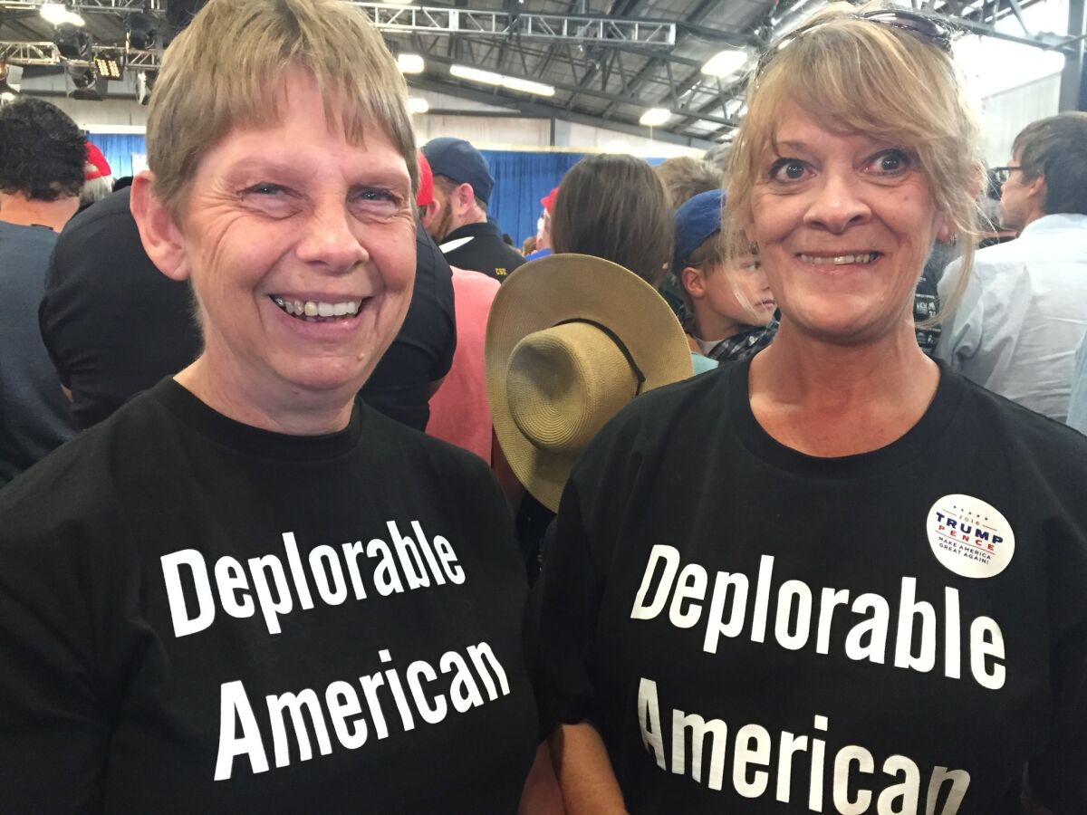 Kathy Smith, right, and her neighbor Tina Griffiths attend a Donald Trump rally in Colorado. (Lisa Mascaro / Los Angeles Times)