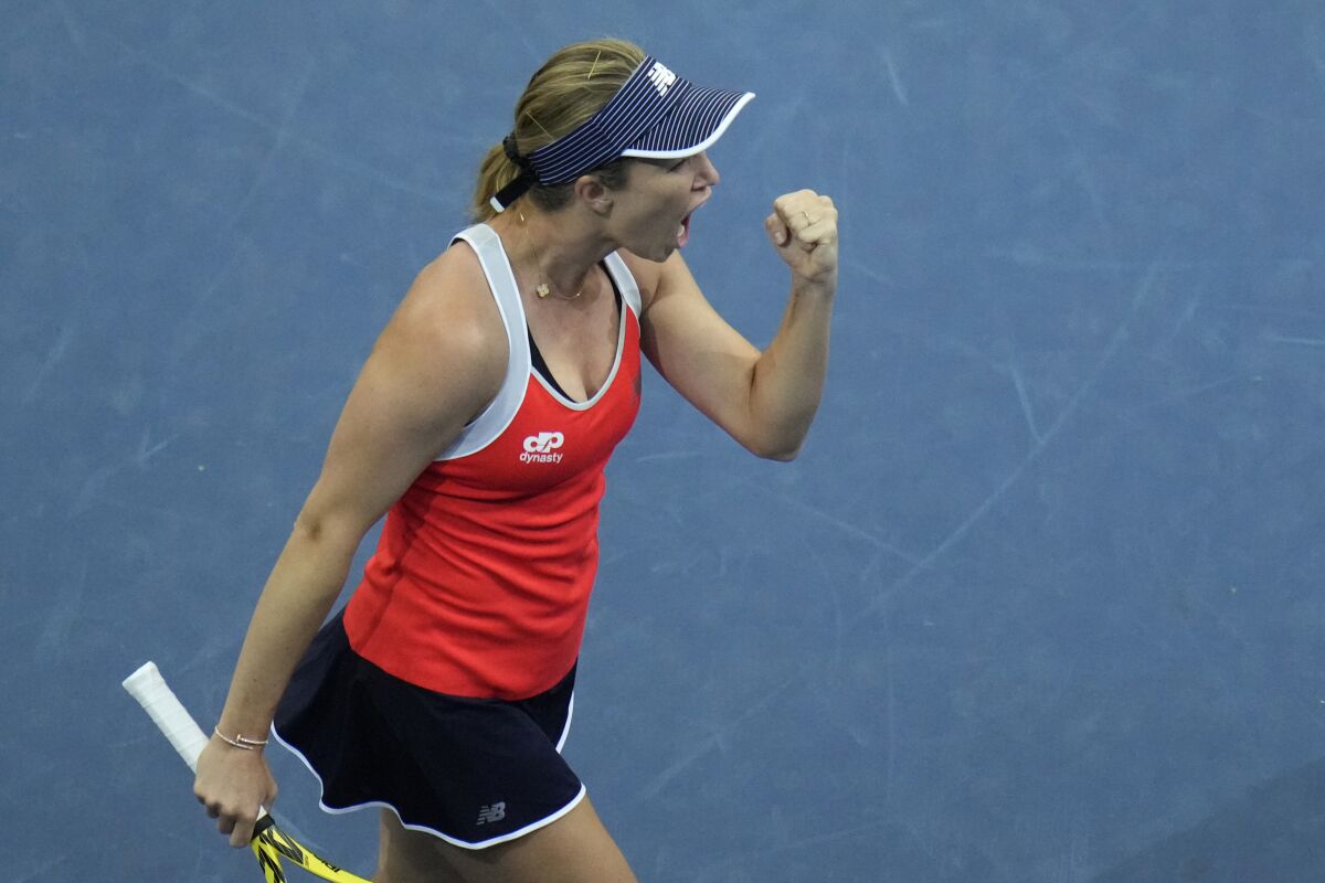 US Danielle Collins celebrates after winning a point against Spain's Sara Sorribes Tormo during their group C Billie Jean King Cup finals tennis match in Prague, Czech Republic, Wednesday, Nov. 3, 2021. (AP Photo/Petr David Josek)