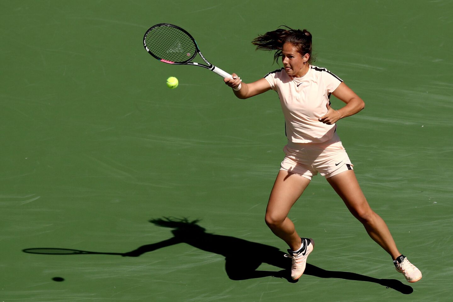 INDIAN WELLS, CA - MARCH 18: Daria Kasatkina of Russia returns a shot to Naomi Osaka of Japan during the women's final on Day 14 of the BNP Paribas Open at the Indian Wells Tennis Garden on March 18, 2018 in Indian Wells, California. (Photo by Matthew Stockman/Getty Images) ** OUTS - ELSENT, FPG, CM - OUTS * NM, PH, VA if sourced by CT, LA or MoD **