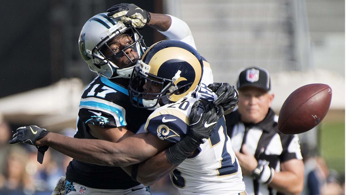 Rams cornerback Lamarcus Joyner, right, commits pass interference while defending Panthers receiver Devin Fuchess in the first quarter.
