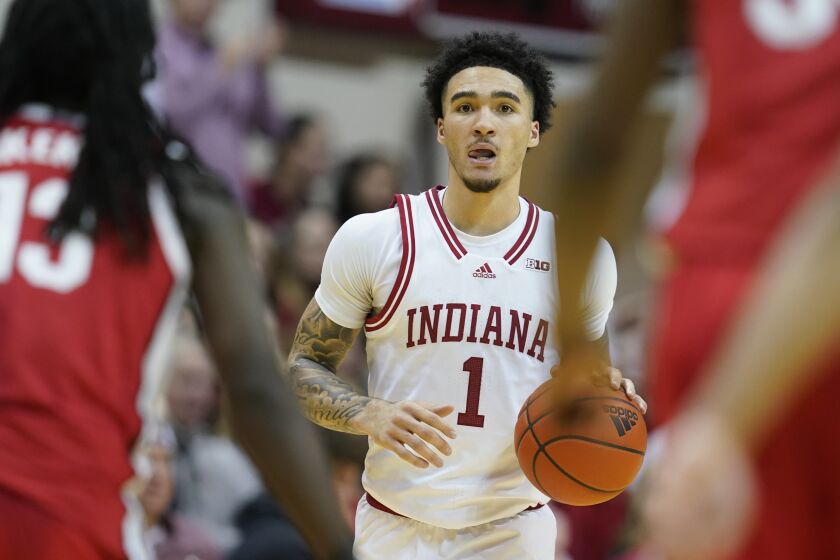 Indiana's Jalen Hood-Schifino dribbles during the second half of an NCAA college basketball game against Ohio State, Saturday, Jan. 28, 2023, in Bloomington, Ind. (AP Photo/Darron Cummings)