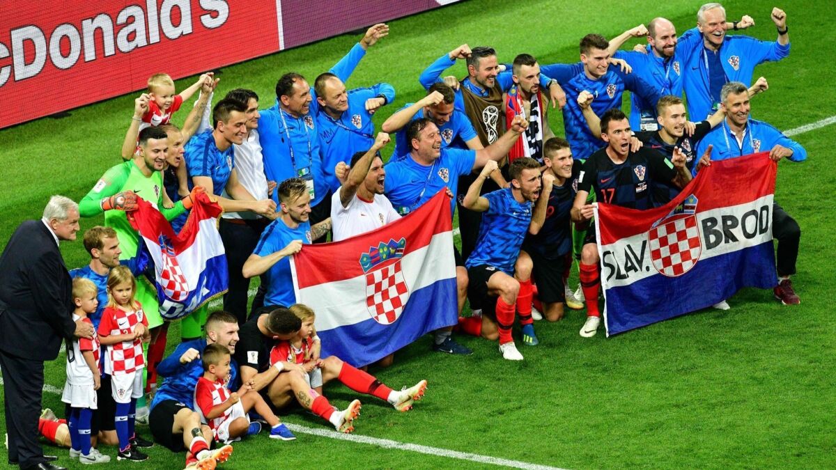 Croatia's players pose for a photo on July 11 after defeating England in the World Cup semifinals.