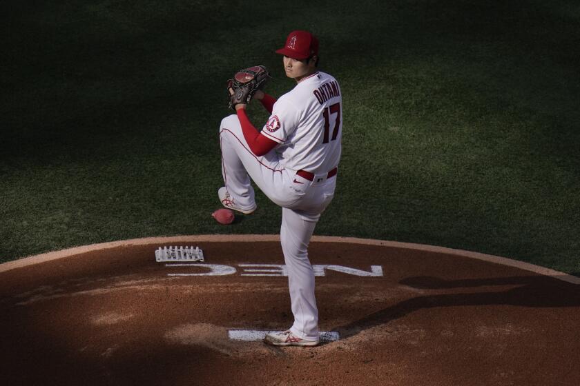 Los Angeles Angels starting pitcher Shohei Ohtani, of Japan, winds up to throw against the Cleveland Indians during the first inning of a baseball game, Wednesday, May 19, 2021, in Anaheim, Calif. (AP Photo/Jae C. Hong)