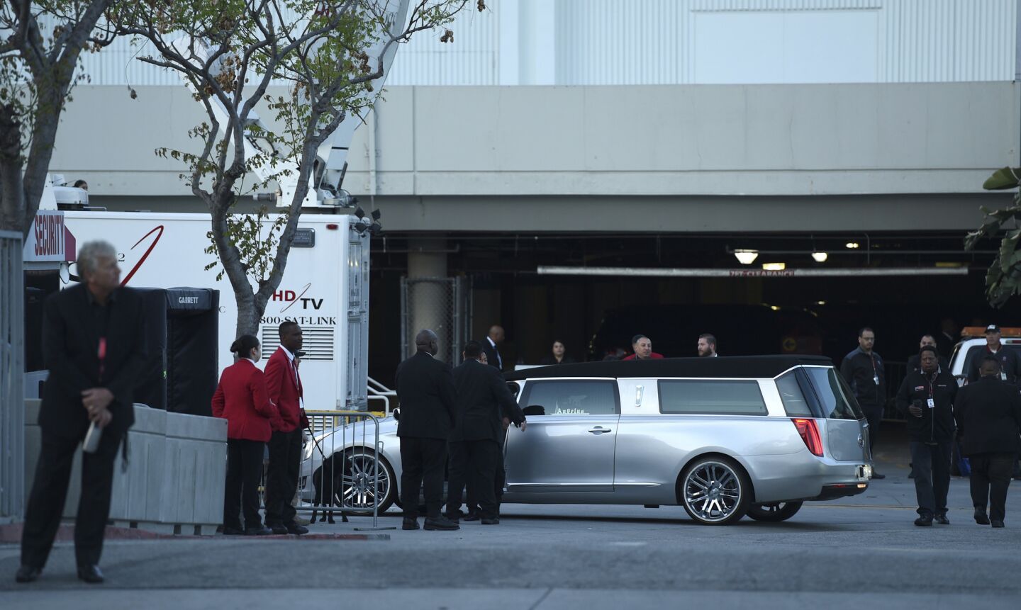 A silver hearse arrives at Staples Center for the memorial service for rapper Nipsey Hussle, whose given name was Ermias Asghedom.