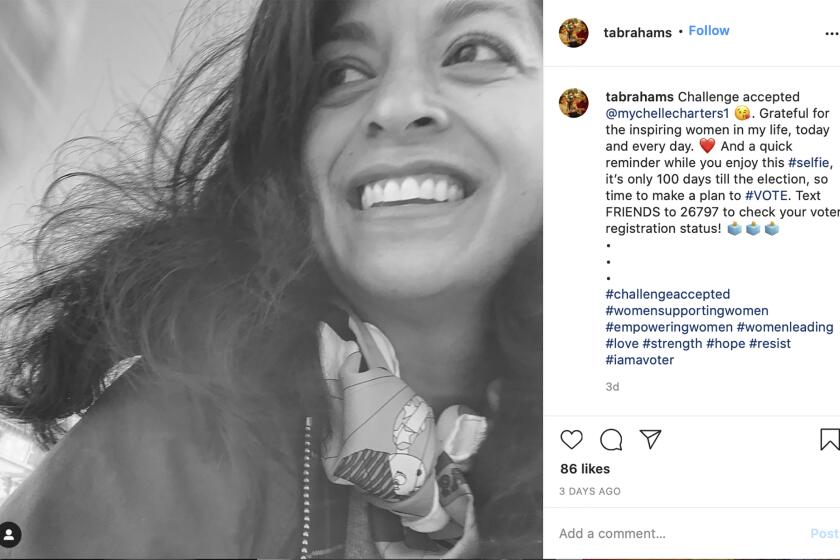 This image provided by Tara Abrahams shows her Instagram post with the #challengeaccepted joining female users across the United States, flooding the photo-sharing app with black-and-white images. The official goal: a show of support for other women. Abrahams, the philanthropic advisor from New York added a caption encouraging people to check their voter registration status and make a plan to vote in November. (Tara Abrahams via AP)