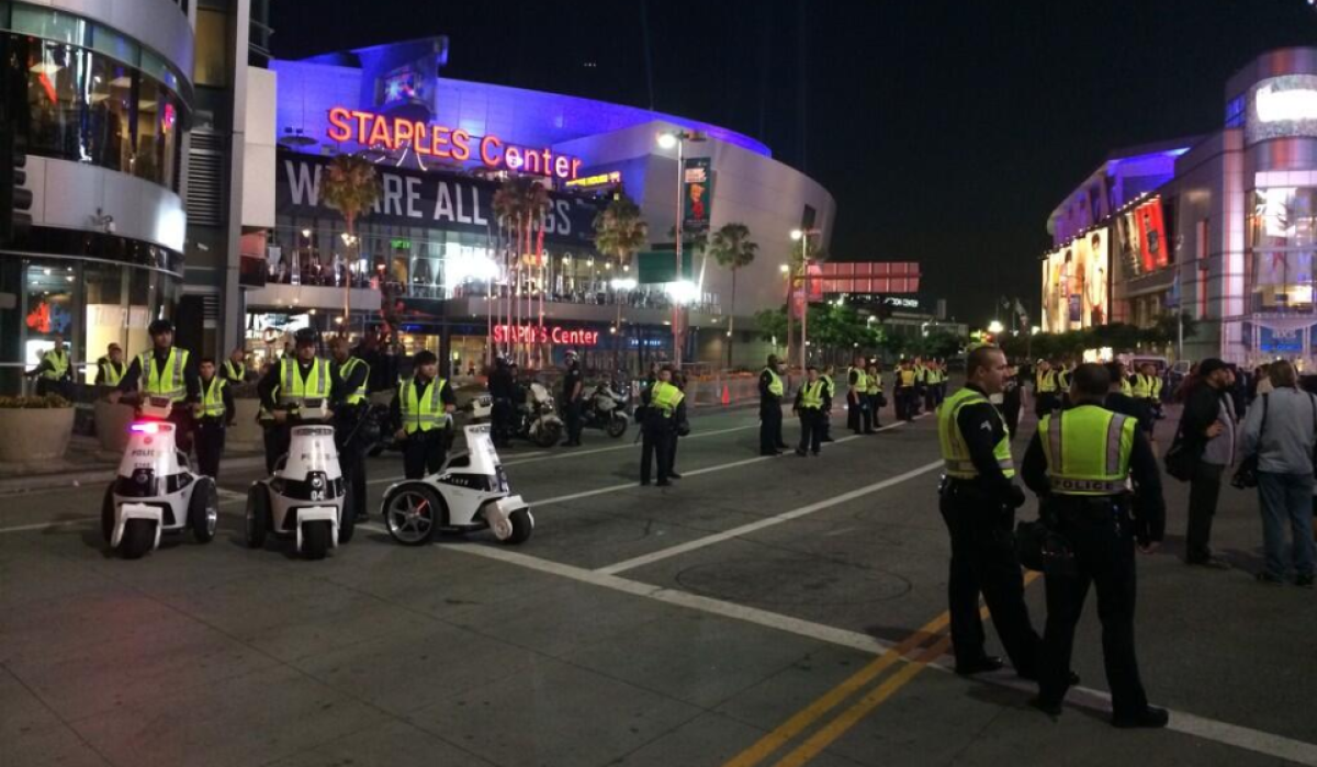 LAPD was out in force outside Staples Center where the Kings were vying for the Stanley Cup. At least one man had been arrested and another hurt in separate incidents while the game was still in play.