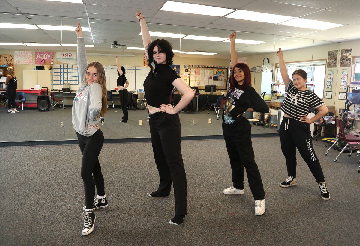 Nicole Sullivan, left, Moss Elliott, Yaretzi Pastrana, and Gwen Alvarado, members of the Back Bay High School dance team.