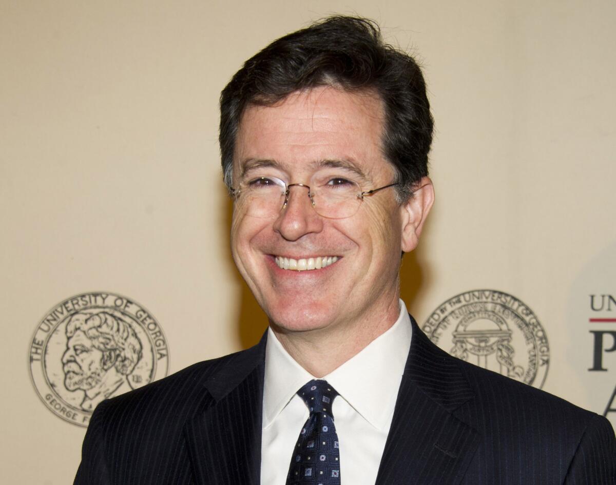 Stephen Colbert paid tribute to departing "Late Show" host David Letterman on his show Thursday, with a coy reference to his own appointment to succeed him. "I gotta tell you, I do not envy whoever they try to put in that chair," Colbert said.
