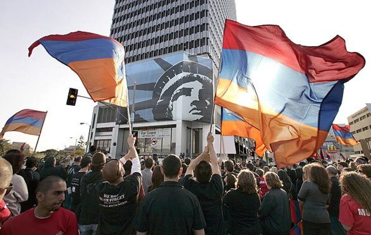 Protesters wave the Armenian flag during an April 2009 demonstration outside the Turkish Consulate on Wilshire Boulevard, calling for an end to Turkey's denials of an Armenian genocide.