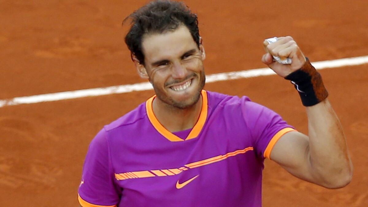 Rafael Nadal celebrates after defeating Dominic Thiem in the Madrid Open championship match on Sunday.