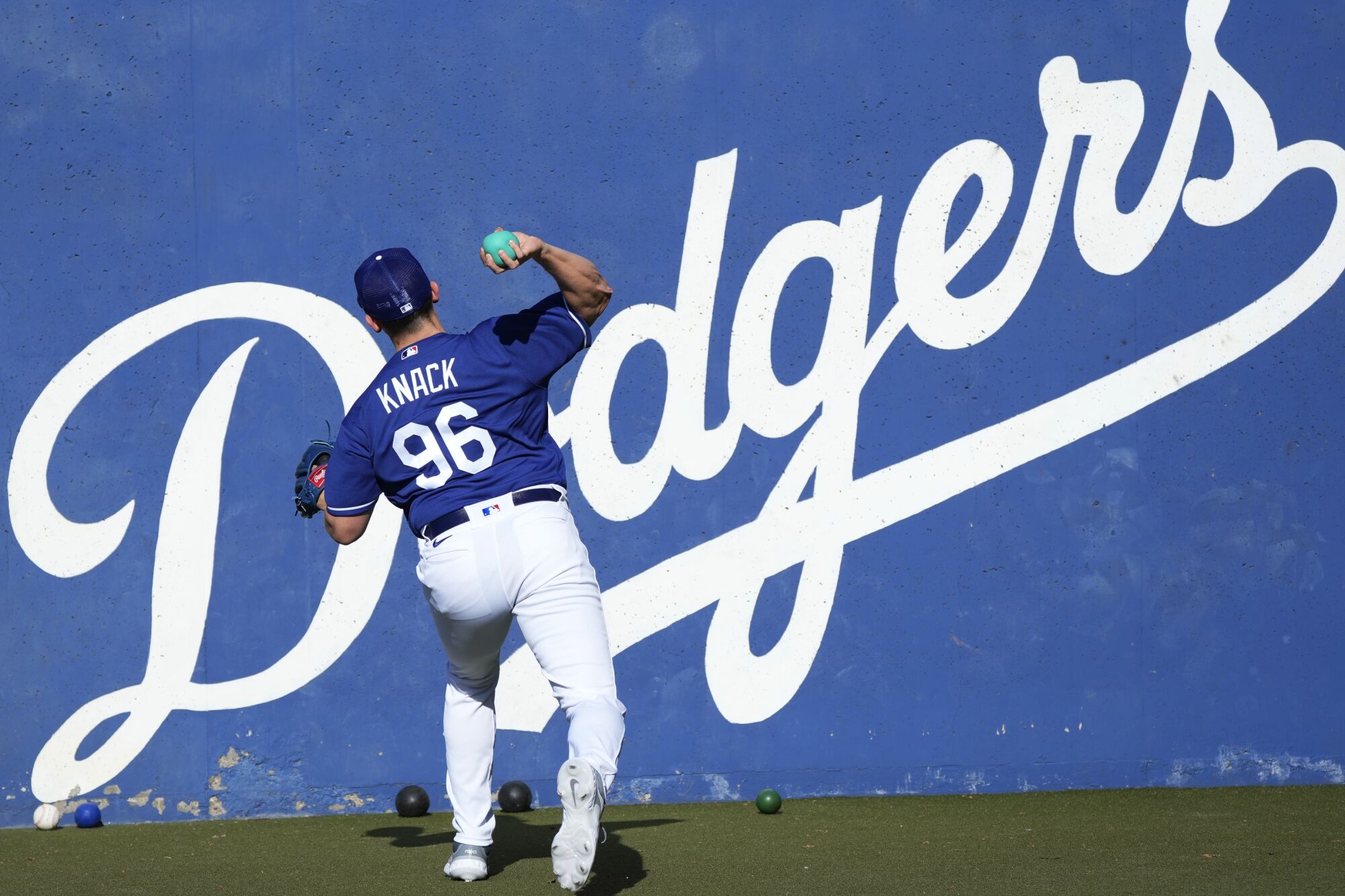 Dodgers pitcher Landon Knack warms up during spring training workouts in Phoenix on Feb. 20, 2023.