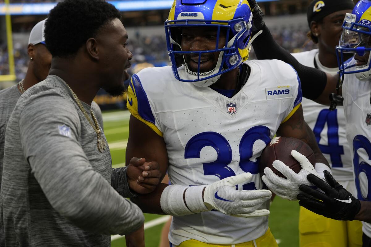  Rams safety Jaylen McCollough is congratulated after intercepting a Chargers pass during their preseason game. 