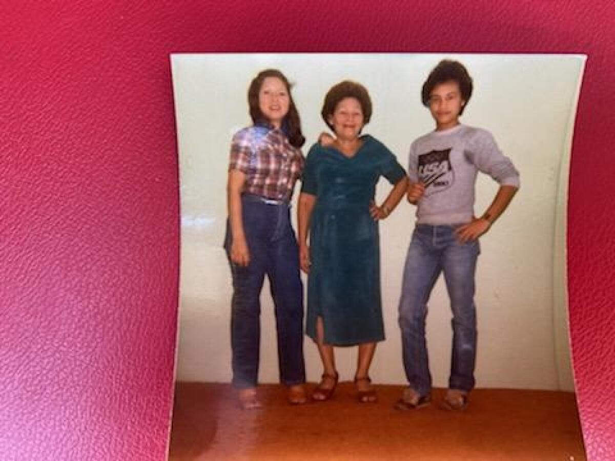Carlos Ernesto Escobar Mejia with his sister Rosa and their mother