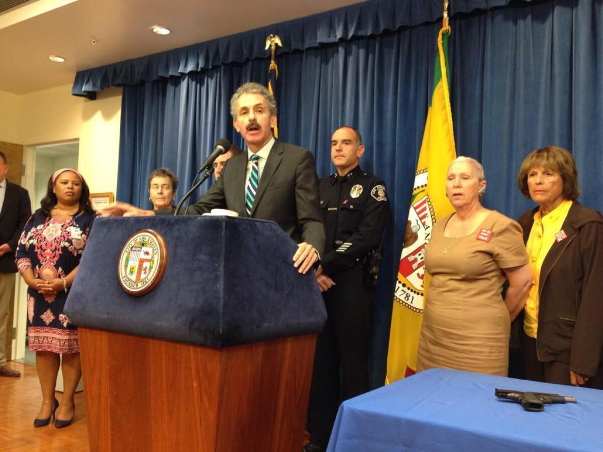 City Atty. Mike Feuer announces criminal charges against a woman whose son allegedly took a loaded gun to a Van Nuys high school.