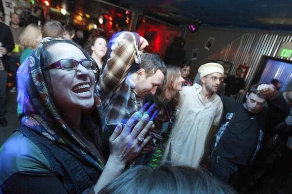 Faith Gabidas, left, dances while the Taqwacore band Al-Thawra plays at the Star Bar in celebration of the premiere of the Eyad Zahra film, "The Taqwacores." Gabidas created the costumes and did makeup for the film.