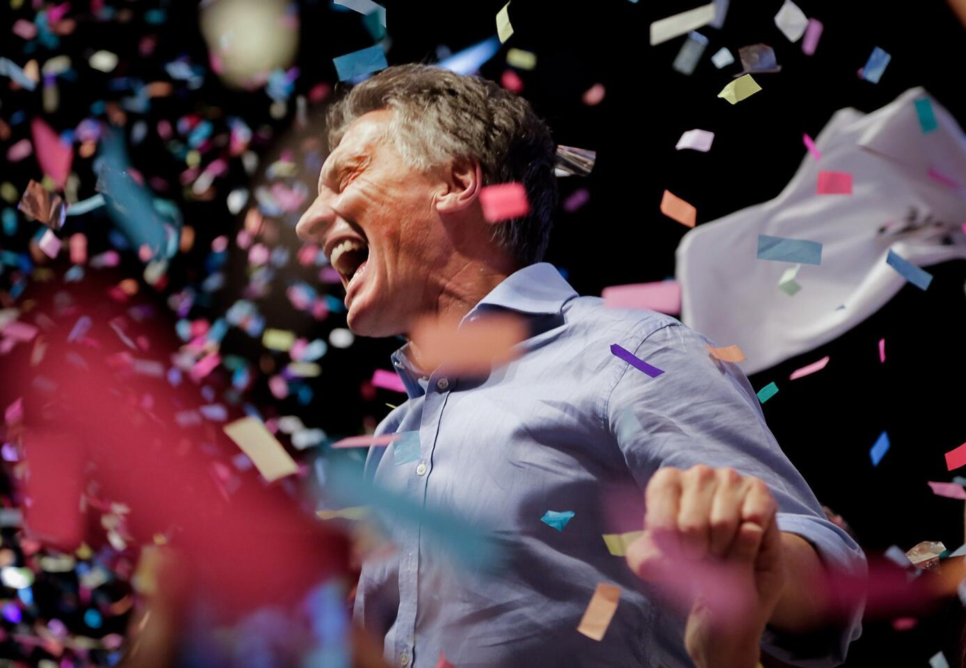 Mauricio Macri celebrates at the Cambiemos (Let's Change) party headquarters in Buenos Aires, after getting early results of the presidential runoff election in Argentina.