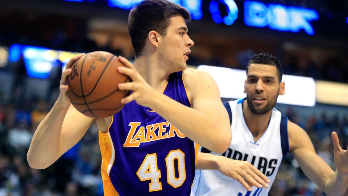 Lakers center Ivica Zubac looks to protect the ball against Dallas' Salah Mejri on Jan. 22.