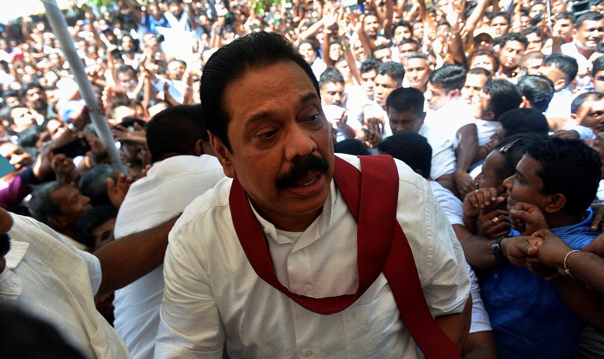 Sri Lanka's former president, Mahinda Rajapakse, attends a rally where he announced that he will lead an opposition faction at forthcoming general elections, months after being defeated at presidential polls following a decade in power.