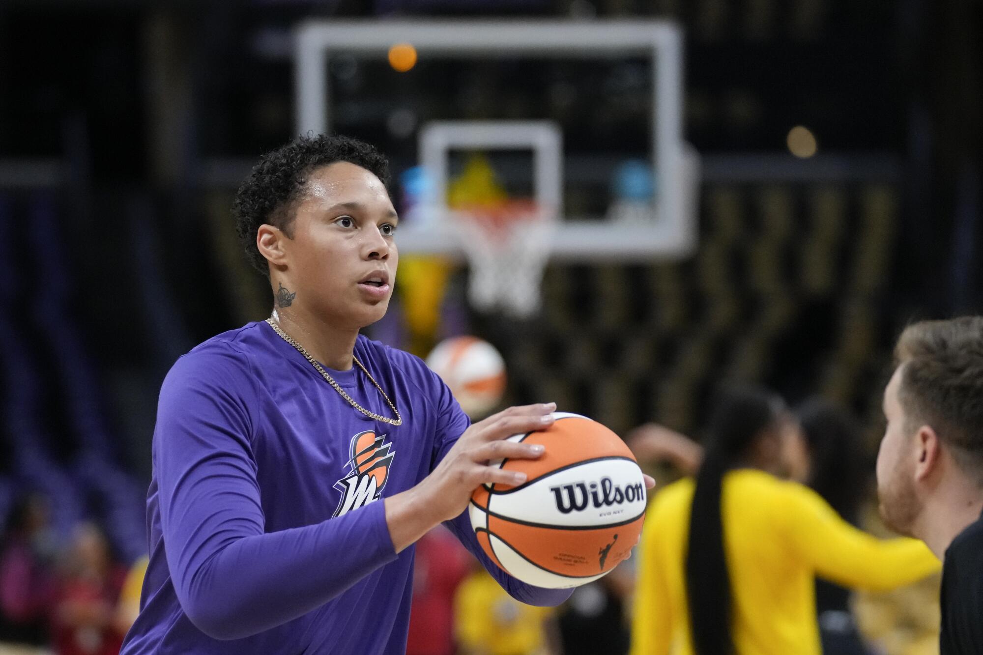 Phoenix Mercury center Brittney Griner prepares to shoot the ball while warming up before facing the Sparks.