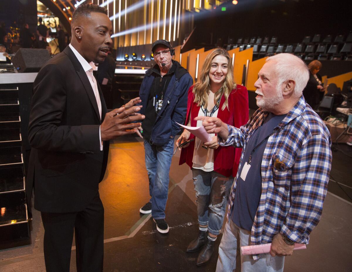 Producer Ken Ehrlich, right, with host Arsenio Hall on the set of ABC's "Greatest Hits" at CBS Studios in Studio City. The six-episode summer series will cover 25 years of pop hits.