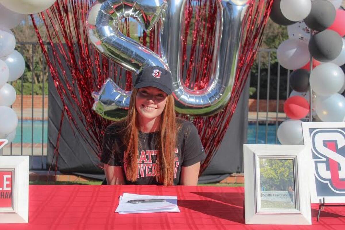 Woodland Hills Louisville softball standout Grace Luderer smiles during a signing day ceremony for Seattle University.