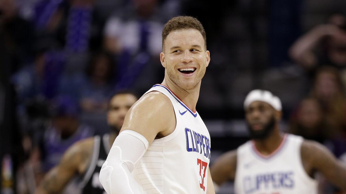 FILE - In this Jan. 11, 2018, file photo, Los Angeles Clippers forward Blake Griffin smiles during the second half of an NBA basketball game against the Sacramento Kings in Sacramento, Calif. The Detroit Pistons dramatically shook their struggling roster by acquiring one of the NBA's top players in Griffin in a trade with the Clippers. The deal for the five-time All-Star forward was announced early Tuesday, Jan. 30, 2018, giving Detroit a player who has been the face of the Clippers but whose career has been undercut by injuries.