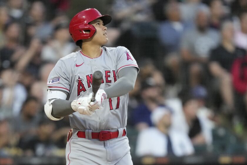 Los Angeles Angels' Shohei Ohtani watches his home run off Chicago White Sox starting pitcher Lucas Giolito during the fourth inning of a baseball game Tuesday, May 30, 2023, in Chicago. (AP Photo/Charles Rex Arbogast)