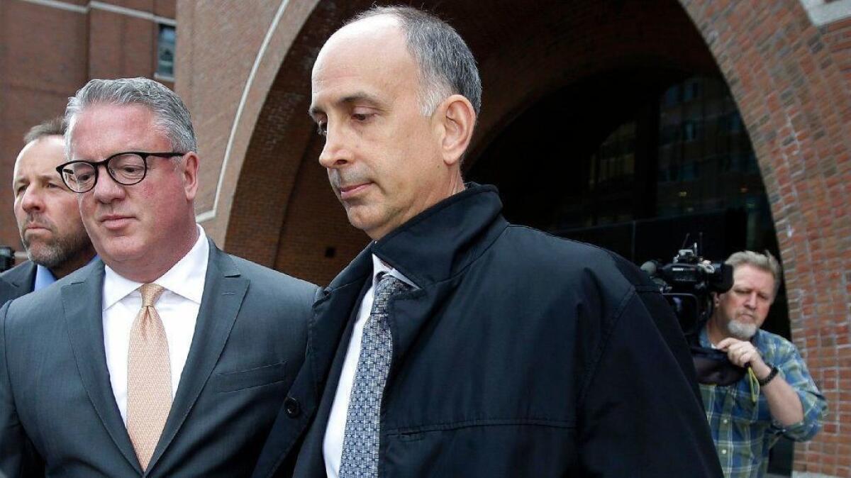 California businessman Stephen Semprevivo, whose son's admission to Georgetown was withdrawn, departs federal court in Boston on May 7.