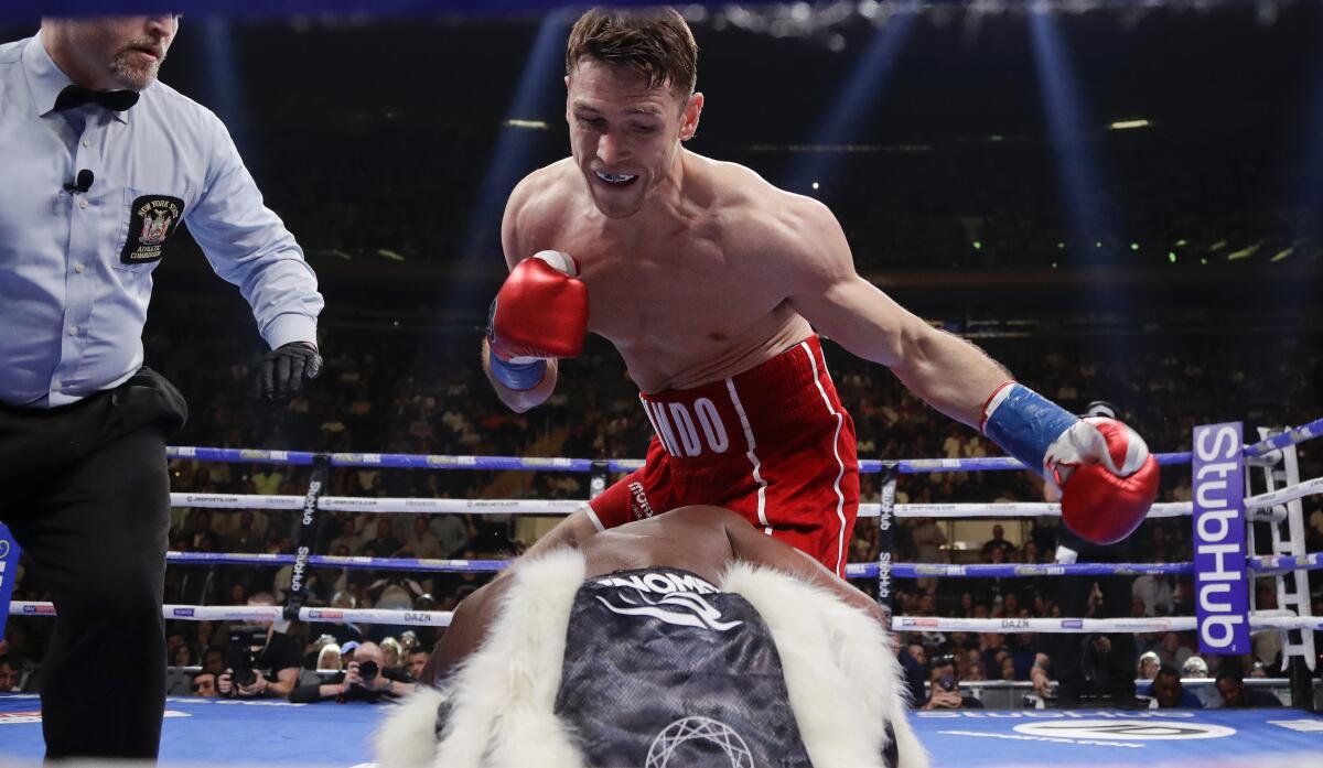 Callum Smith, above, knocks down Hassan N'Dam during their super middleweight title fight in June 2019 in New York.