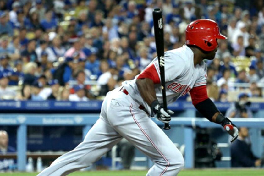 Roger Bernadina gets a run-scoring hit against the Dodgers while playing for the Cincinnati Reds earlier this season.