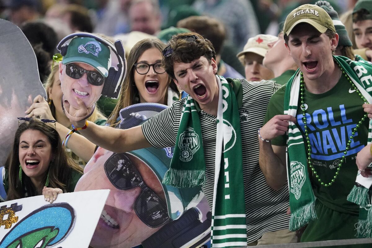 Tulane fans cheer during the first half at the Cotton Bowl.