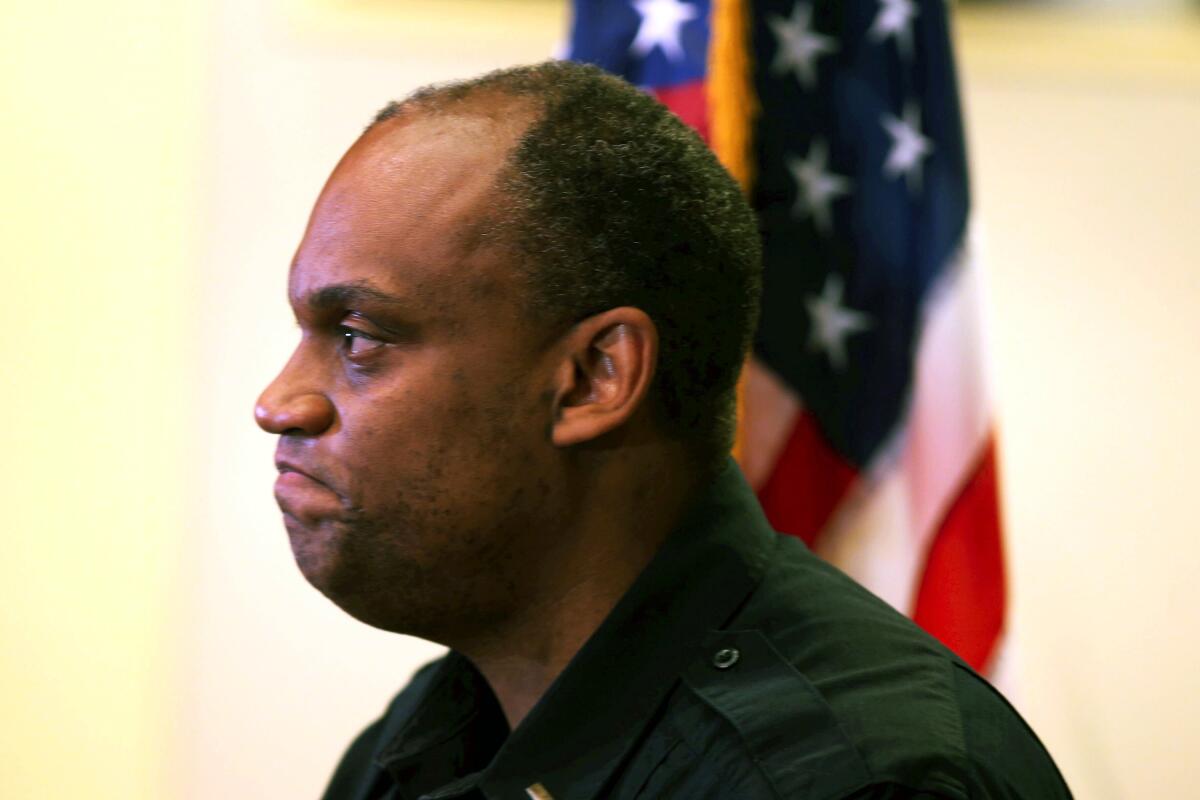 New Police Chief Chuck Lovell listens during a news conference announcing his appointment in Portland, Ore.